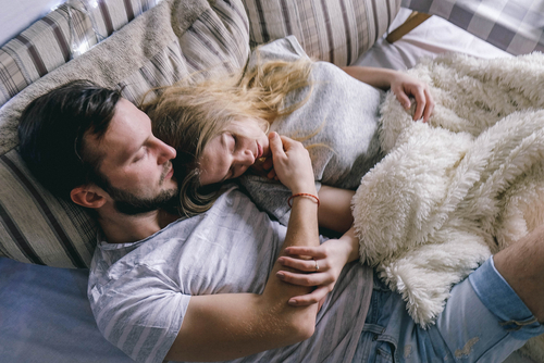 Loveandfriends couple in bed together embracing